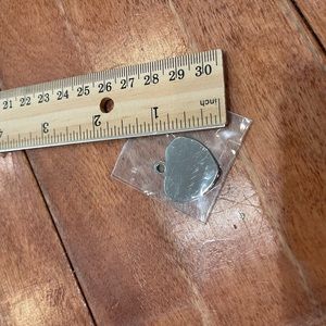 Heart-shaped silver dog/small pet tag.